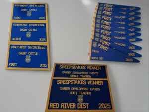 Blue and gold FFA award plaques and ribbons