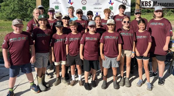 Youth team group photo wearing maroon shirts