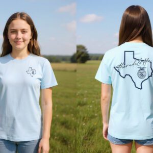 Girl wearing light blue Texas t-shirt in field